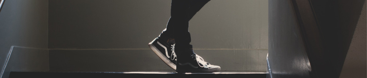 a person wearing vans on a staircase