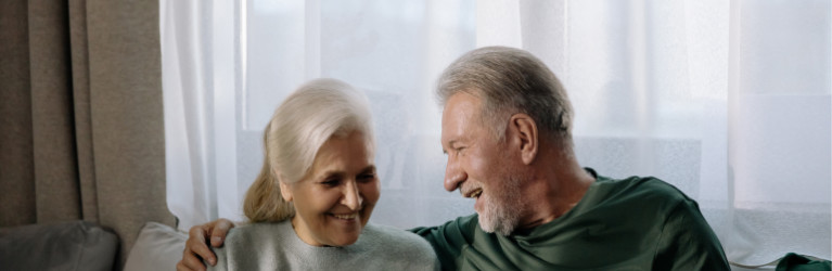 2 people in a room with their arms around each other